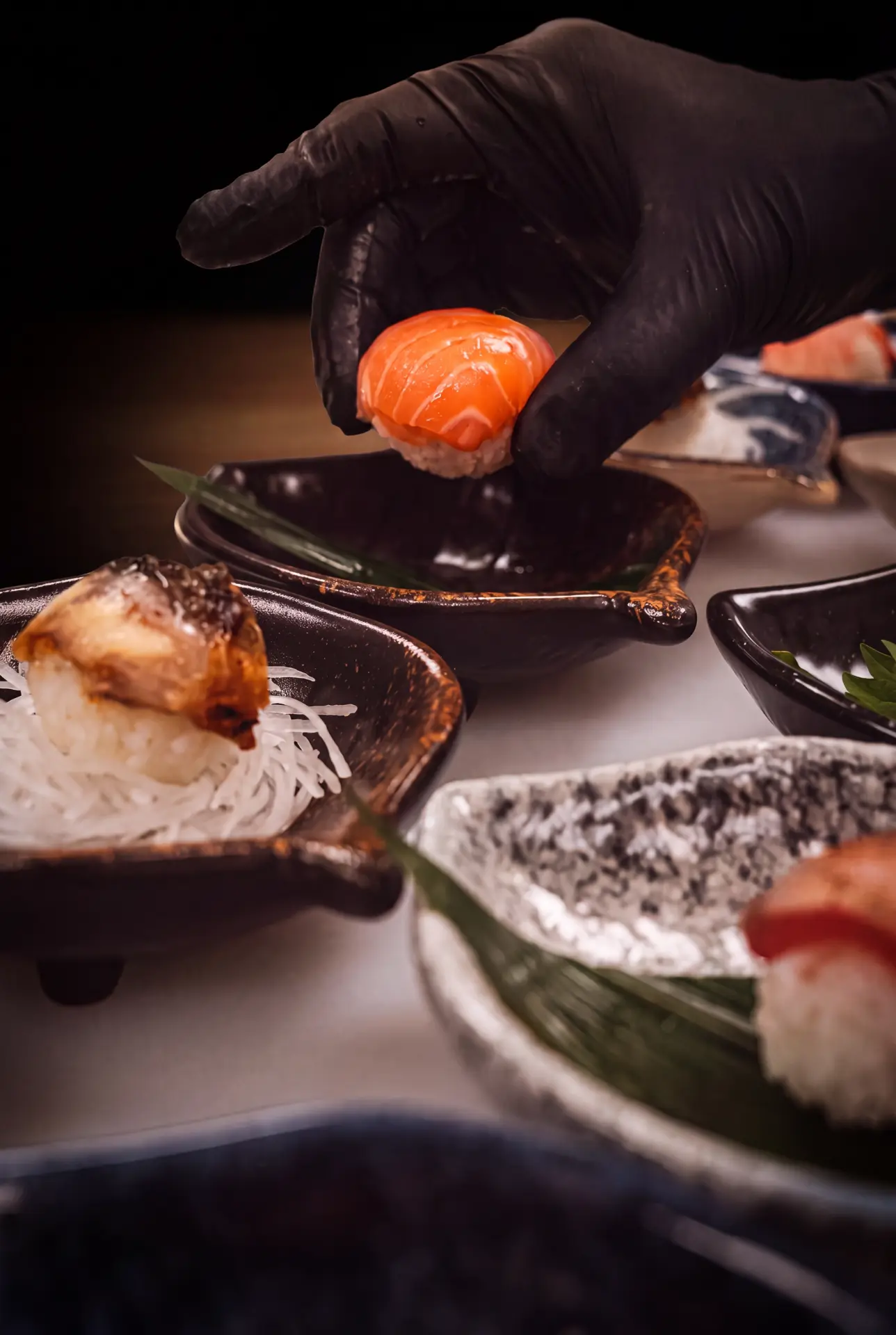 Temari delicately set down on lacquer plates
