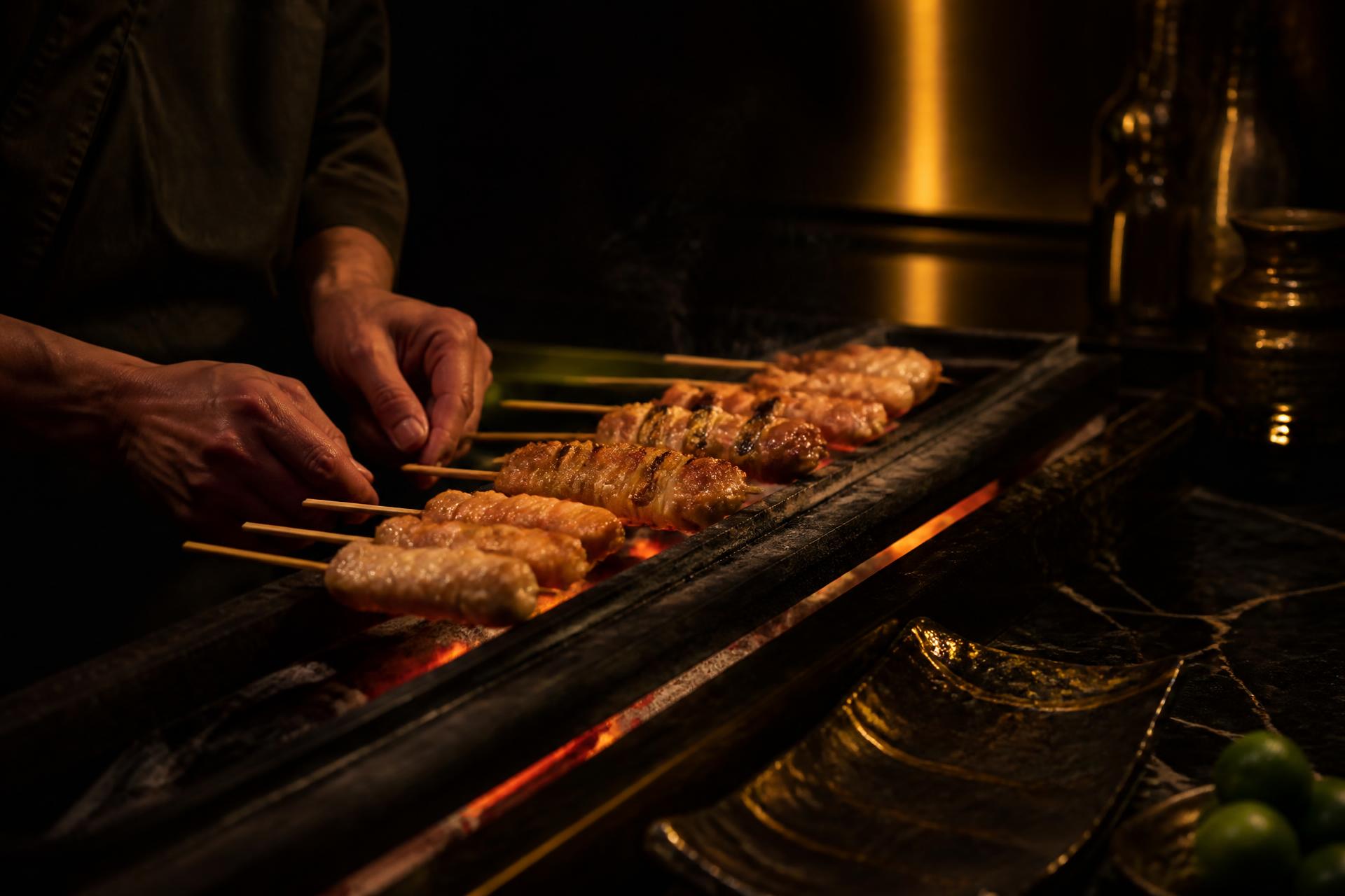 Yakitori master at work · Tadashi Bando